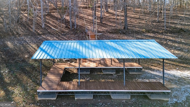 view of swimming pool featuring a dock