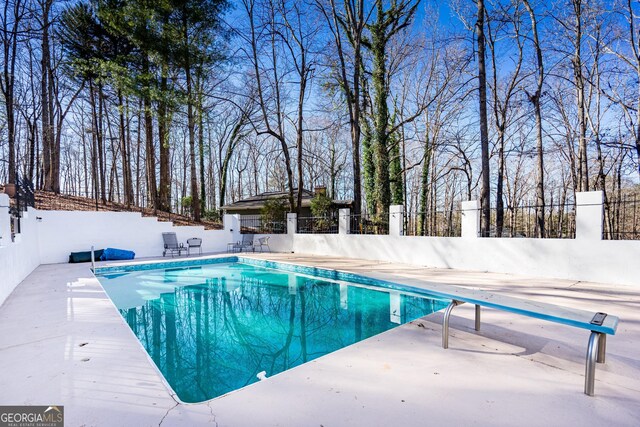 view of pool featuring a patio area