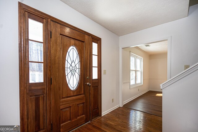 unfurnished living room featuring ceiling fan, ornamental molding, and a textured ceiling