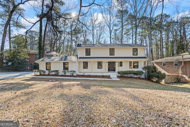 view of front facade with a porch and a front yard