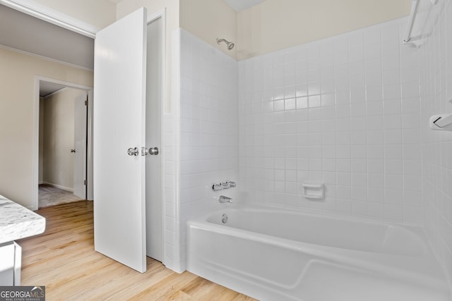 bathroom with vanity,  shower combination, and hardwood / wood-style floors