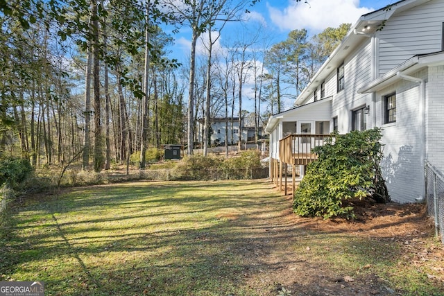 view of yard featuring a wooden deck