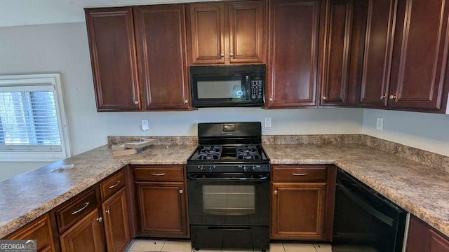 kitchen with light tile patterned floors and black appliances