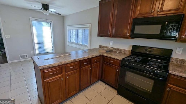 kitchen featuring ceiling fan, light tile patterned floors, kitchen peninsula, and black appliances