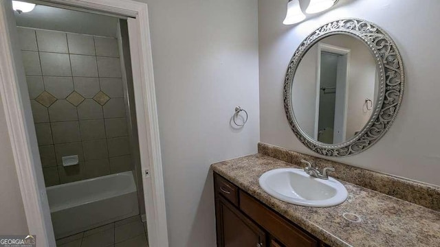 bathroom featuring a tub to relax in and vanity