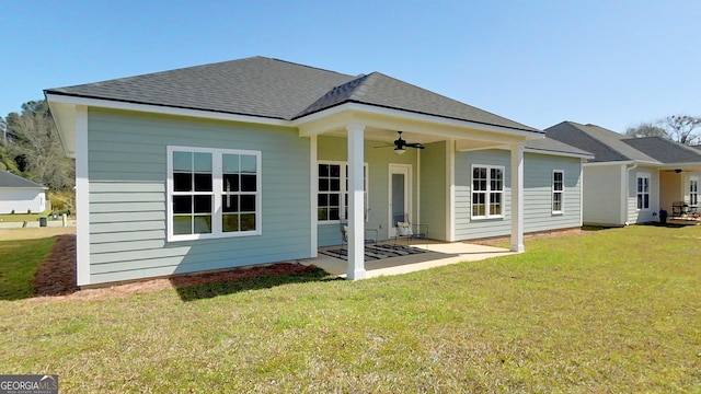 1013 Syrup Mill Creek Ln, Cairo, GA 39828 - back of property with a yard, a patio, a ceiling fan, and roof with shingles