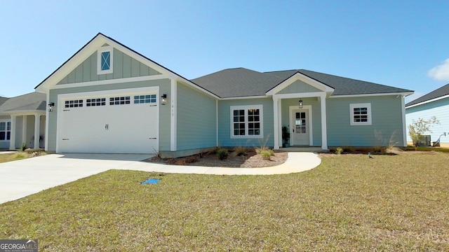 1013 Syrup Mill Creek Ln, Cairo, GA 39828 - single story home with driveway, roof with shingles, a front lawn, a garage, and board and batten siding