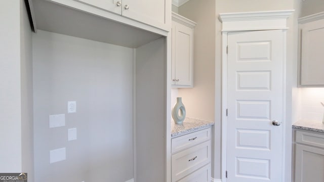 1013 Syrup Mill Creek Ln, Cairo, GA 39828 - kitchen with white cabinets and light stone countertops