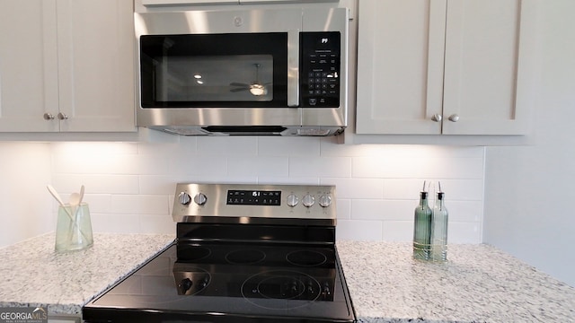1013 Syrup Mill Creek Ln, Cairo, GA 39828 - kitchen featuring light stone counters, tasteful backsplash, and stainless steel appliances