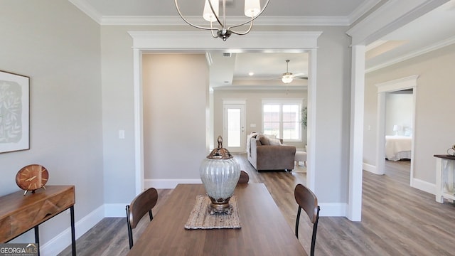 1013 Syrup Mill Creek Ln, Cairo, GA 39828 - dining area featuring ceiling fan with notable chandelier, wood finished floors, baseboards, and ornamental molding