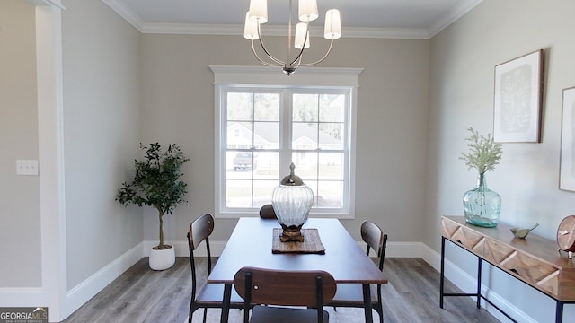 1013 Syrup Mill Creek Ln, Cairo, GA 39828 - dining space featuring baseboards, wood finished floors, a chandelier, and crown molding
