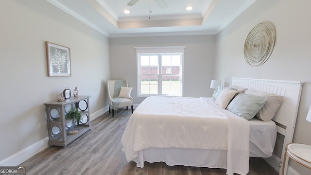 1013 Syrup Mill Creek Ln, Cairo, GA 39828 - bedroom with baseboards, a tray ceiling, ornamental molding, recessed lighting, and wood finished floors