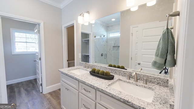1013 Syrup Mill Creek Ln, Cairo, GA 39828 - bathroom featuring a shower stall, crown molding, baseboards, and a sink