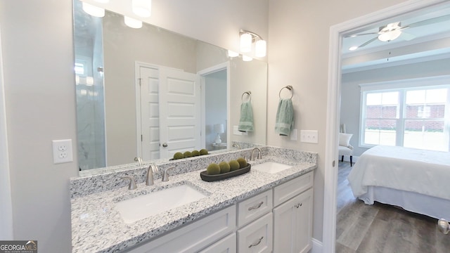1013 Syrup Mill Creek Ln, Cairo, GA 39828 - bathroom featuring double vanity, wood finished floors, ensuite bathroom, and a sink