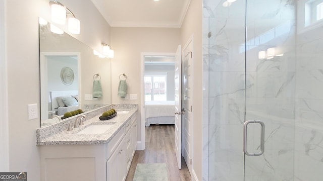1013 Syrup Mill Creek Ln, Cairo, GA 39828 - bathroom featuring wood finished floors, a marble finish shower, connected bathroom, crown molding, and vanity