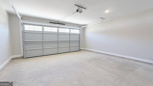 1013 Syrup Mill Creek Ln, Cairo, GA 39828 - garage with baseboards and a garage door opener