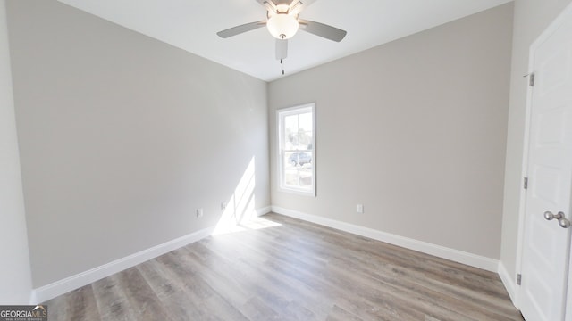 1013 Syrup Mill Creek Ln, Cairo, GA 39828 - empty room featuring baseboards, wood finished floors, and a ceiling fan