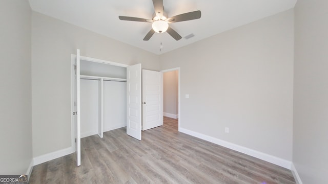 1013 Syrup Mill Creek Ln, Cairo, GA 39828 - unfurnished bedroom featuring visible vents, wood finished floors, baseboards, and a closet