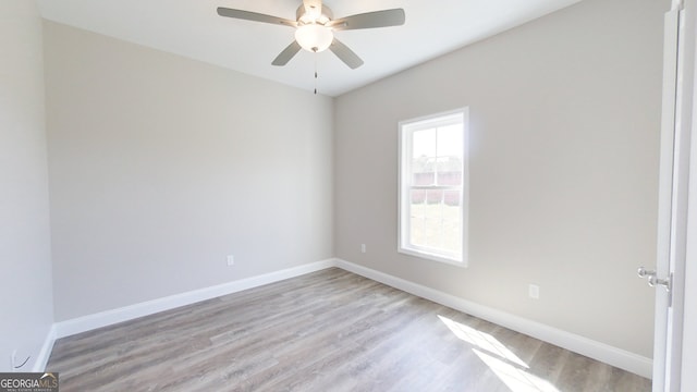 1013 Syrup Mill Creek Ln, Cairo, GA 39828 - spare room featuring baseboards, light wood-style floors, and ceiling fan