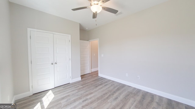1013 Syrup Mill Creek Ln, Cairo, GA 39828 - unfurnished bedroom featuring a ceiling fan, light wood-style flooring, baseboards, and a closet