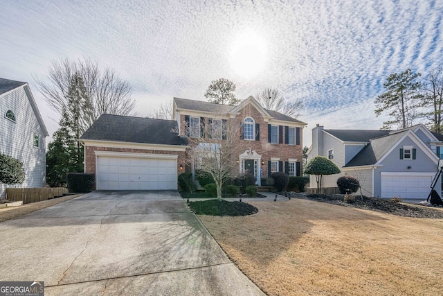 view of front of property featuring a front lawn and a garage