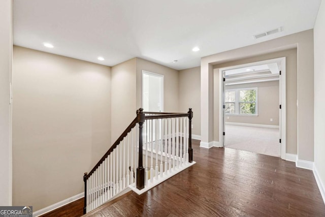 hallway with dark hardwood / wood-style flooring