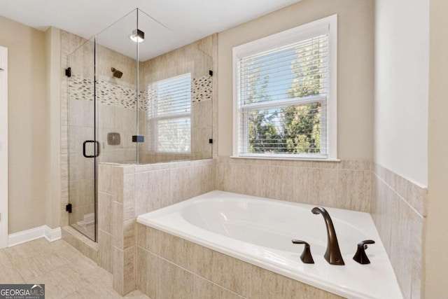 bathroom featuring tile patterned flooring and plus walk in shower