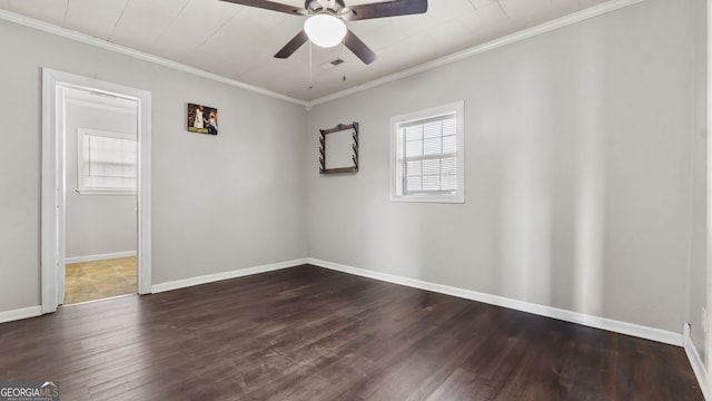 spare room featuring ceiling fan, dark hardwood / wood-style flooring, and crown molding