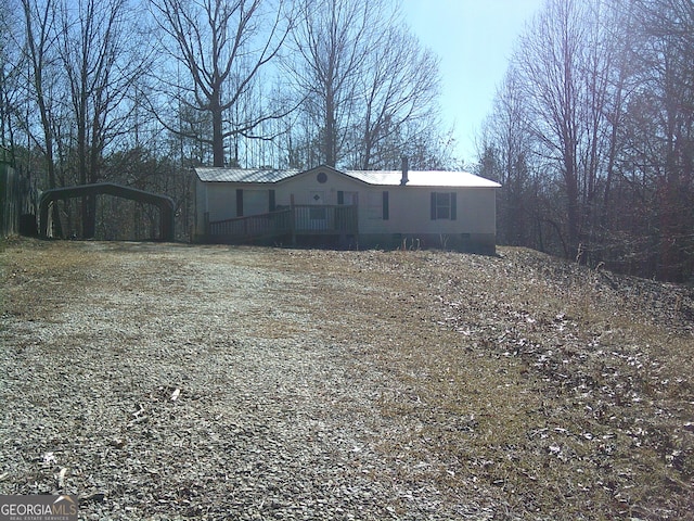 exterior space featuring a carport