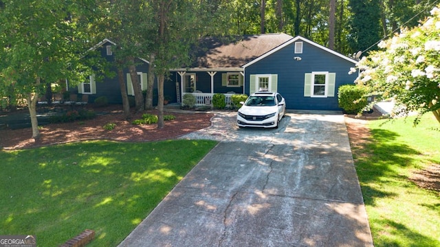 view of front facade with a front lawn and a porch