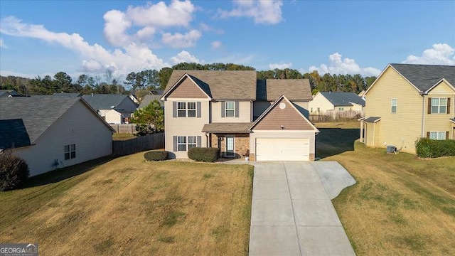 view of front of property featuring a front lawn and a garage