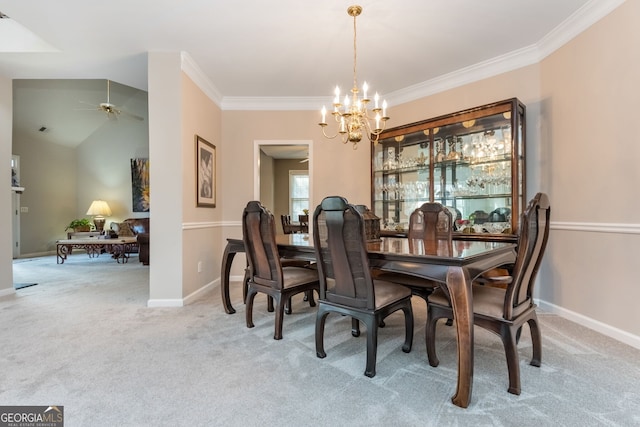 dining space with light colored carpet, ornamental molding, ceiling fan with notable chandelier, and lofted ceiling