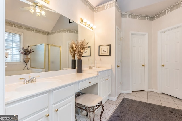 bathroom featuring tile patterned floors, lofted ceiling, vanity, a shower with door, and ceiling fan