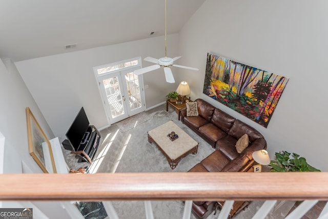 living room with lofted ceiling, carpet flooring, ceiling fan, and french doors