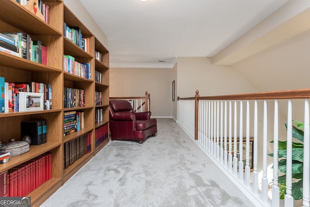 living area featuring light carpet