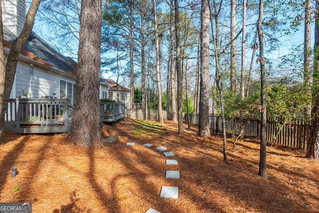 view of yard with a wooden deck