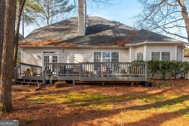 rear view of property with a wooden deck