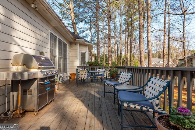 wooden terrace with area for grilling