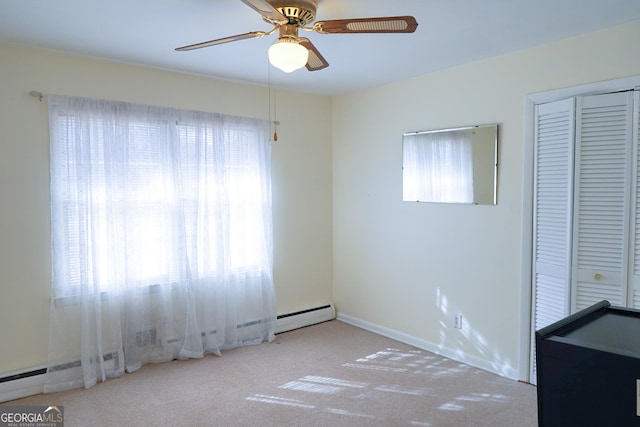 unfurnished bedroom featuring ceiling fan, a closet, and light carpet