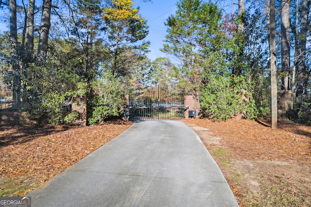 view of road featuring a gated entry and a gate