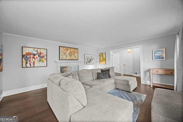 living area featuring ornamental molding, visible vents, dark wood finished floors, and baseboards