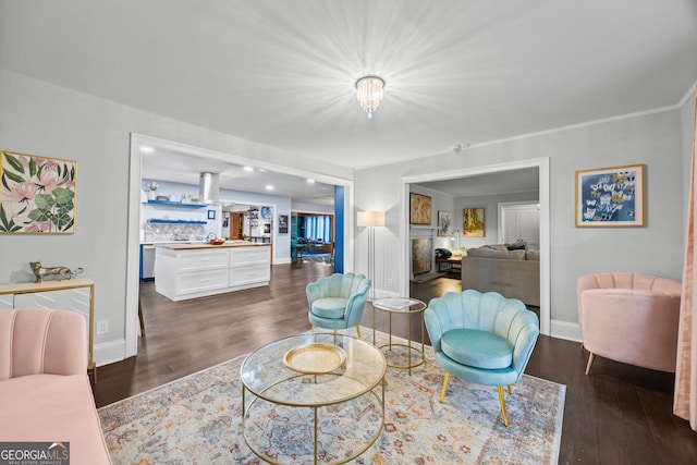 living room with dark wood-style flooring and baseboards