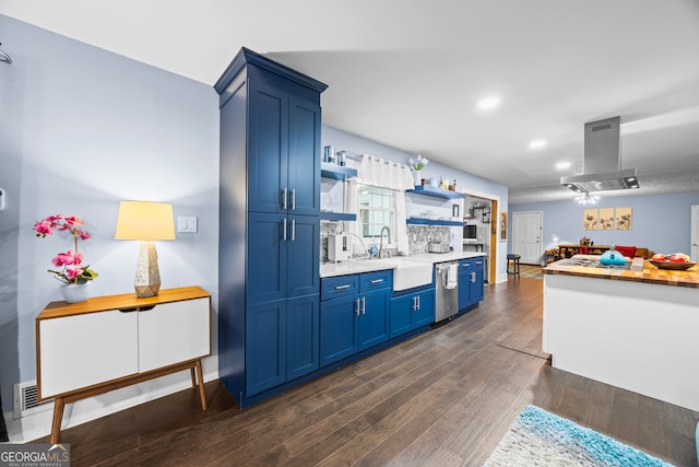 kitchen featuring blue cabinets, island range hood, a sink, light countertops, and open shelves