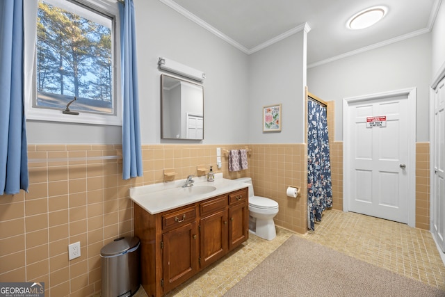 full bathroom with tile walls, tile patterned flooring, wainscoting, and vanity