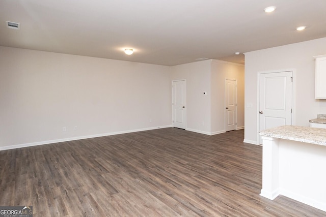 28 Russet Way Lot 60, Newnan, GA 30263 - unfurnished living room featuring dark wood-style floors, recessed lighting, and baseboards