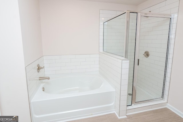 28 Russet Way Lot 60, Newnan, GA 30263 - full bath with a shower stall, a garden tub, baseboards, and wood finished floors