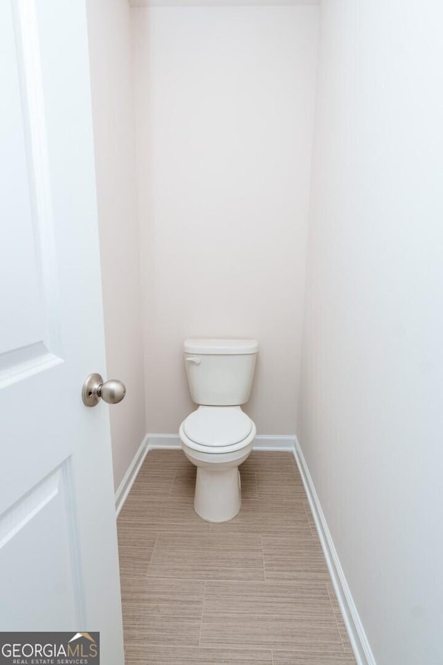 28 Russet Way Lot 60, Newnan, GA 30263 - bathroom featuring toilet, baseboards, and tile patterned flooring