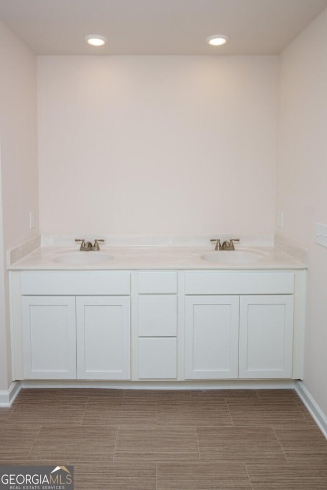 28 Russet Way Lot 60, Newnan, GA 30263 - bathroom with baseboards, recessed lighting, and double vanity