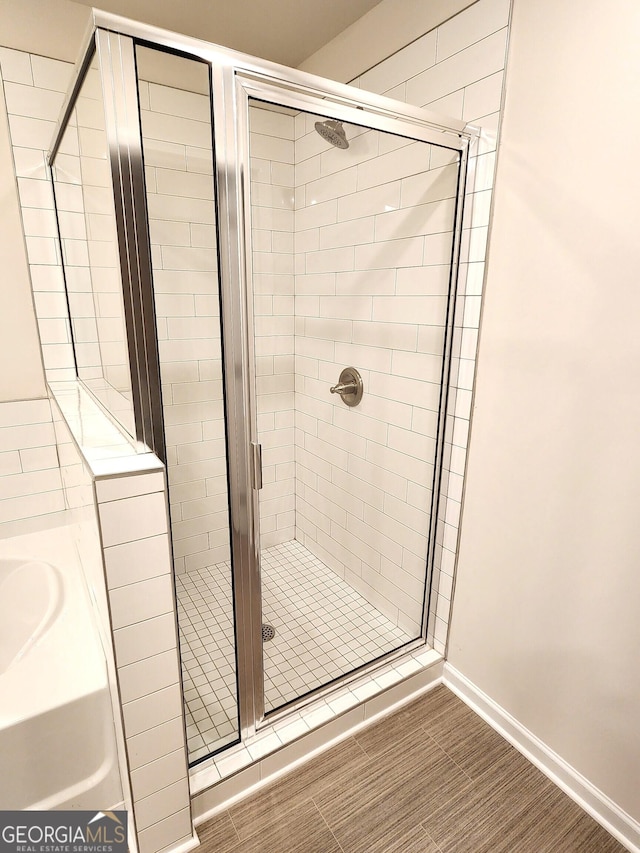 28 Russet Way Lot 60, Newnan, GA 30263 - full bathroom with a shower stall, a garden tub, and baseboards