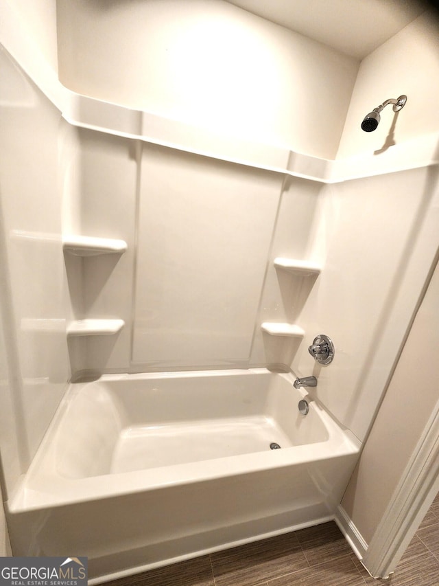 28 Russet Way Lot 60, Newnan, GA 30263 - full bathroom with tub / shower combination, wood finished floors, and baseboards
